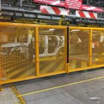 Automated Yellow Mesh Panel Gate For Car Testing Bay