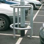 Steel Bars Protecting Lamp Post In Car Park