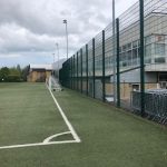 Green Ball Stop Fencing Enclosing Football Field