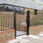 Black Steel Railings on Wall With Gate